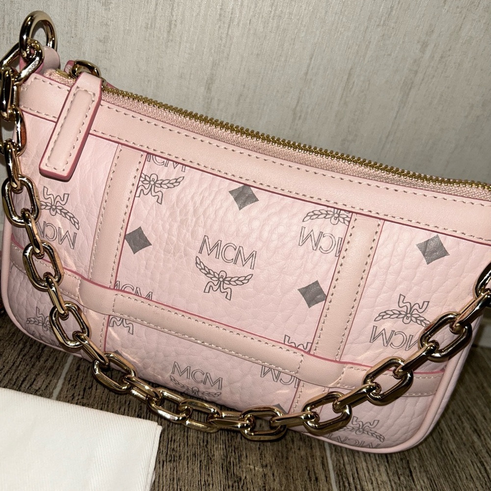 Mini pink MCM hand bag body strap included